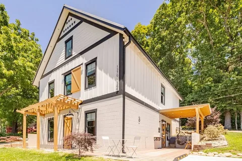 Barndo 3 with pergola-shaded patios on both sides — the third building in the Fairland Ridge booking near Sevierville.