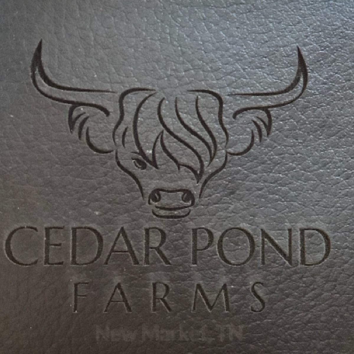 Wallet at the Cedar Pond Farms gift shop — our fluffy Highland cow farm just outside the Smoky Mountains.