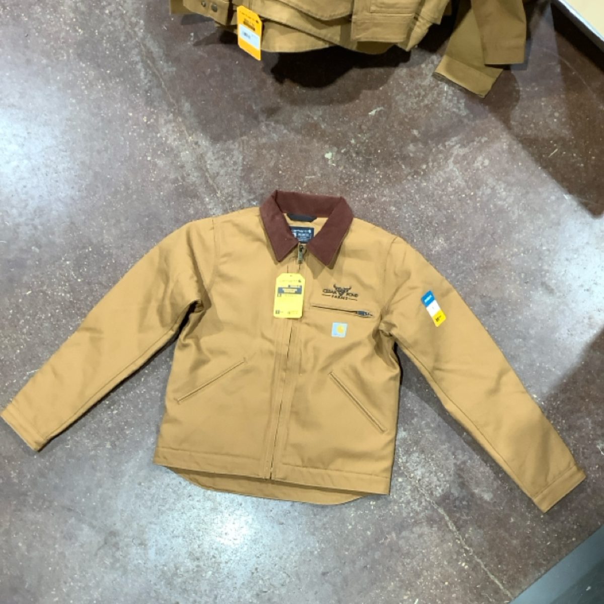 Model 0J3828-M Carhartt Corduroy Collar “Detroit” Jacket at the Cedar Pond Farms gift shop — our fluffy Highland cow farm just outside the Smoky Mountains.