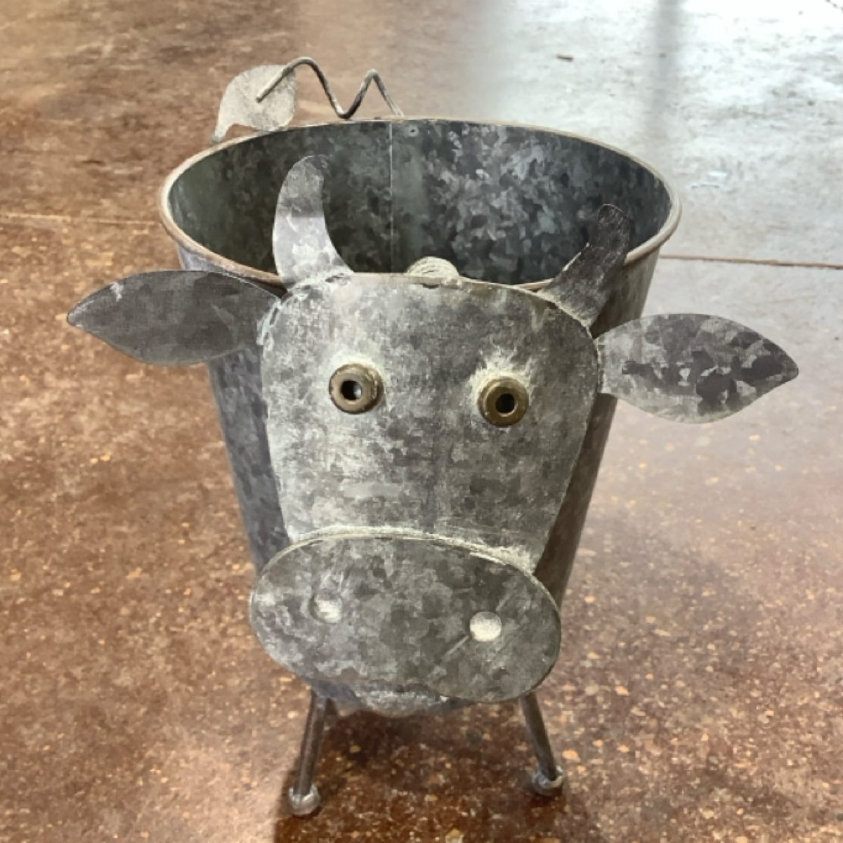 Metal Highland Cow Planter at the Cedar Pond Farms gift shop — our fluffy Highland cow farm just outside the Smoky Mountains.