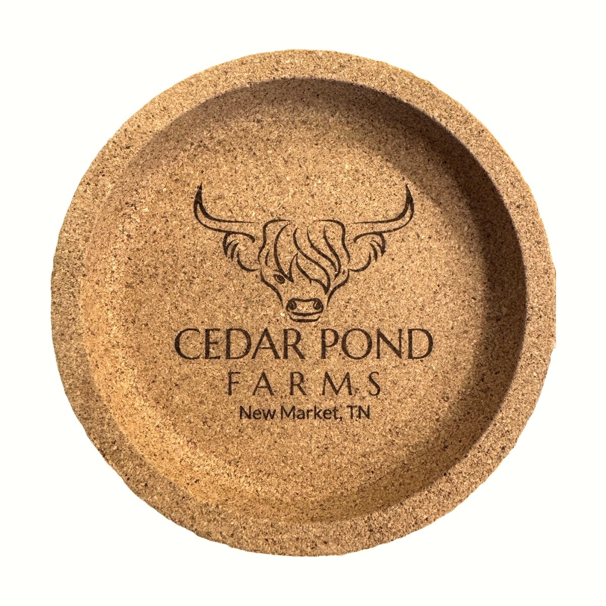 Round cork coaster engraved with a highland cow logo and 'Cedar Pond Farms, New Market, TN' text