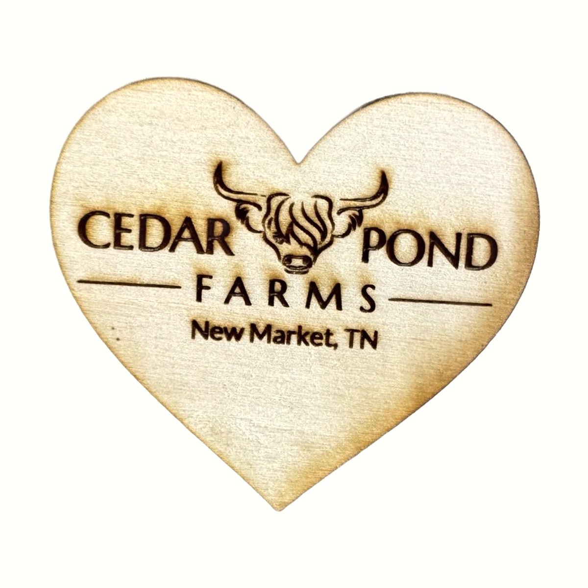 Wooden heart-shaped magnet engraved with Cedar Pond Farms logo, highland cow, and New Market, TN text