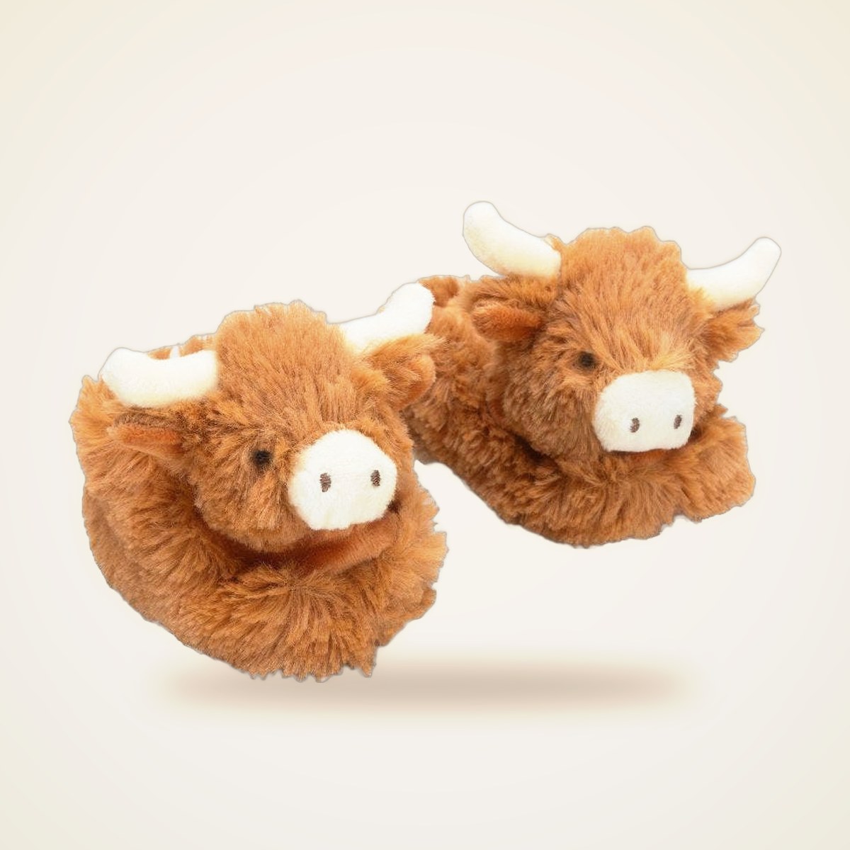 Fluffy Cow Baby Slippers from the APPAREL shelf at the Cedar Pond Farms gift shop — our fluffy Highland cow farm just outside the Smoky Mountains.