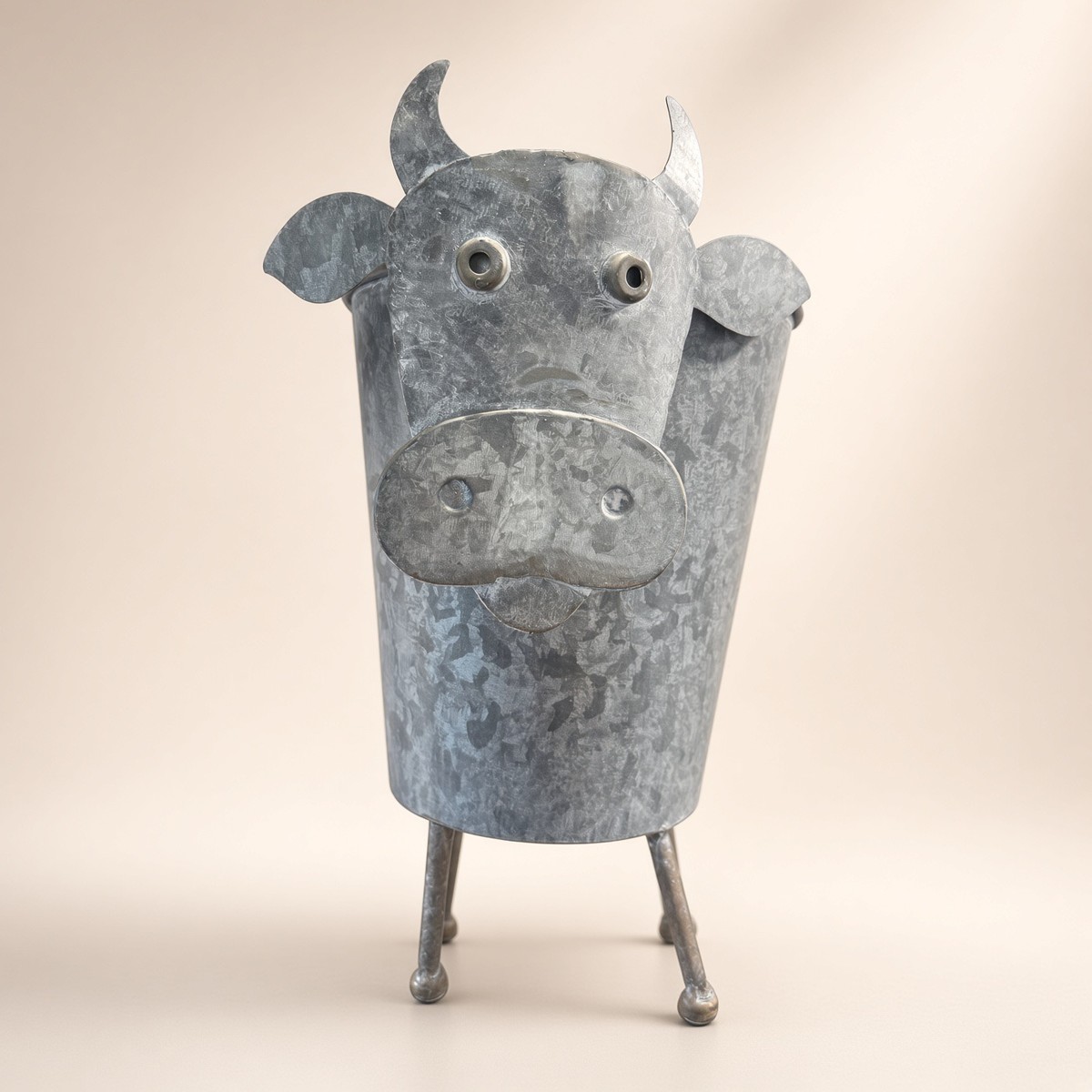Metal Highland Cow Planter from the MISC shelf at the Cedar Pond Farms gift shop — our fluffy Highland cow farm just outside the Smoky Mountains.