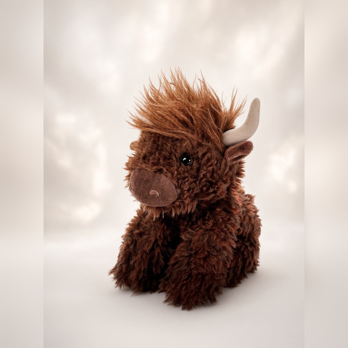 MEDIUM COW — Chocolate Brown Cow from the STUFFIES shelf at the Cedar Pond Farms gift shop — our fluffy Highland cow farm just outside the Smoky Mountains.