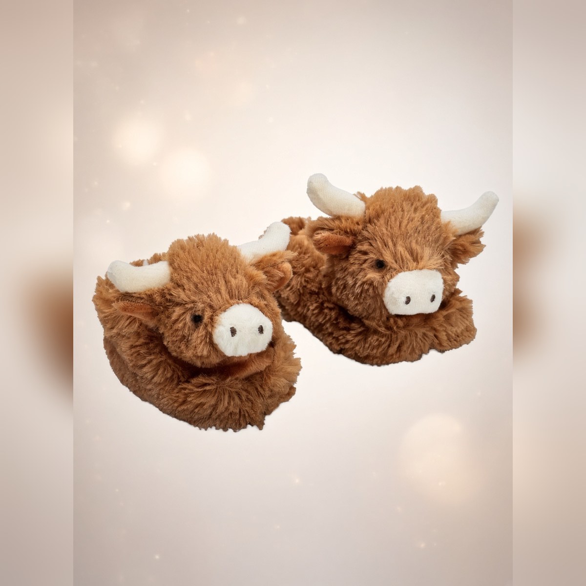 SLIPPERS — Brown Baby Slippers from the APPAREL shelf at the Cedar Pond Farms gift shop — our fluffy Highland cow farm just outside the Smoky Mountains.