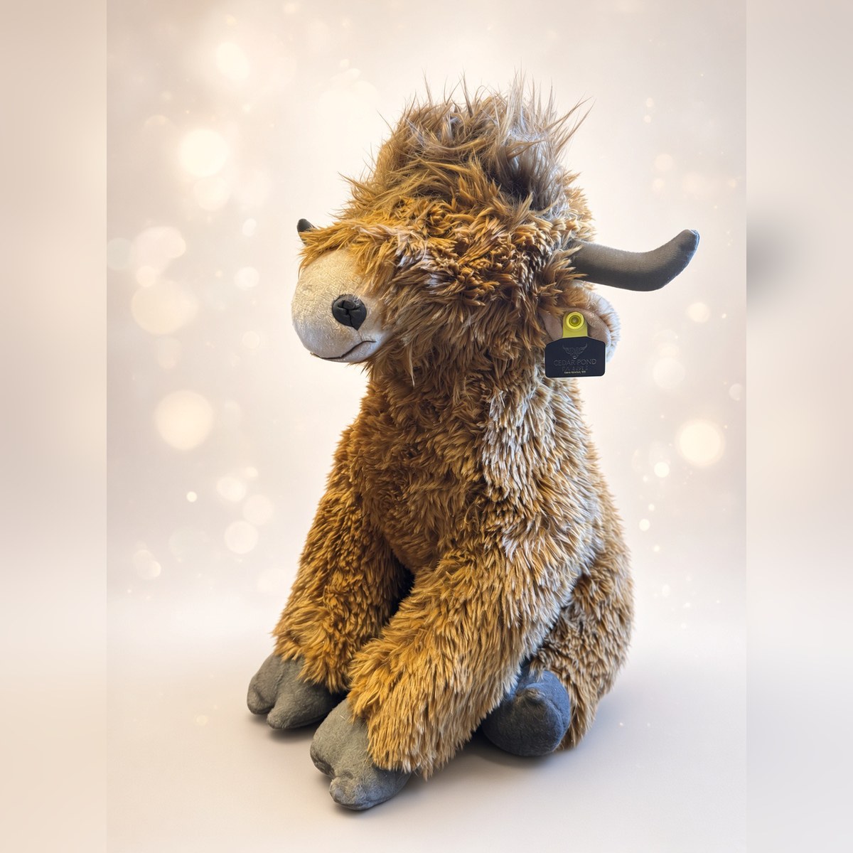JUMBO COW from the STUFFIES shelf at the Cedar Pond Farms gift shop — our fluffy Highland cow farm just outside the Smoky Mountains.