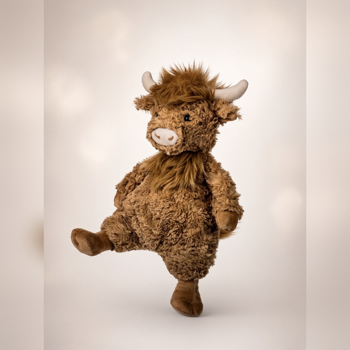Floppy Highland Cow Stuffie from the STUFFIES shelf at the Cedar Pond Farms gift shop — our fluffy Highland cow farm just outside the Smoky Mountains.