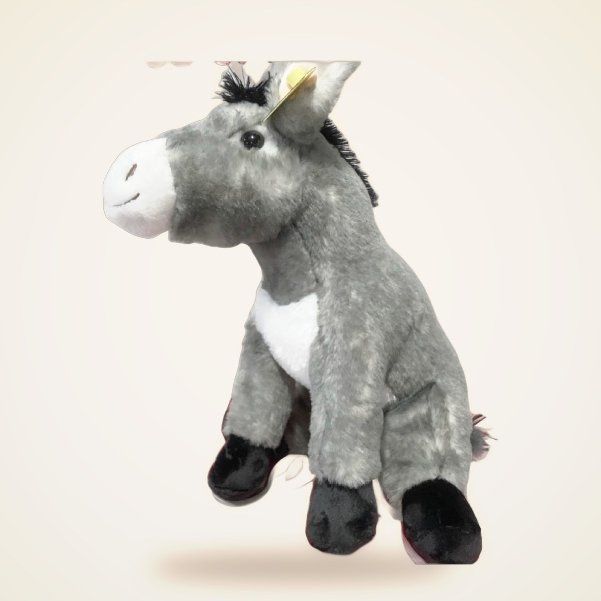Big Donkey Stuffed Animal from the STUFFIES shelf at the Cedar Pond Farms gift shop — our fluffy Highland cow farm just outside the Smoky Mountains.