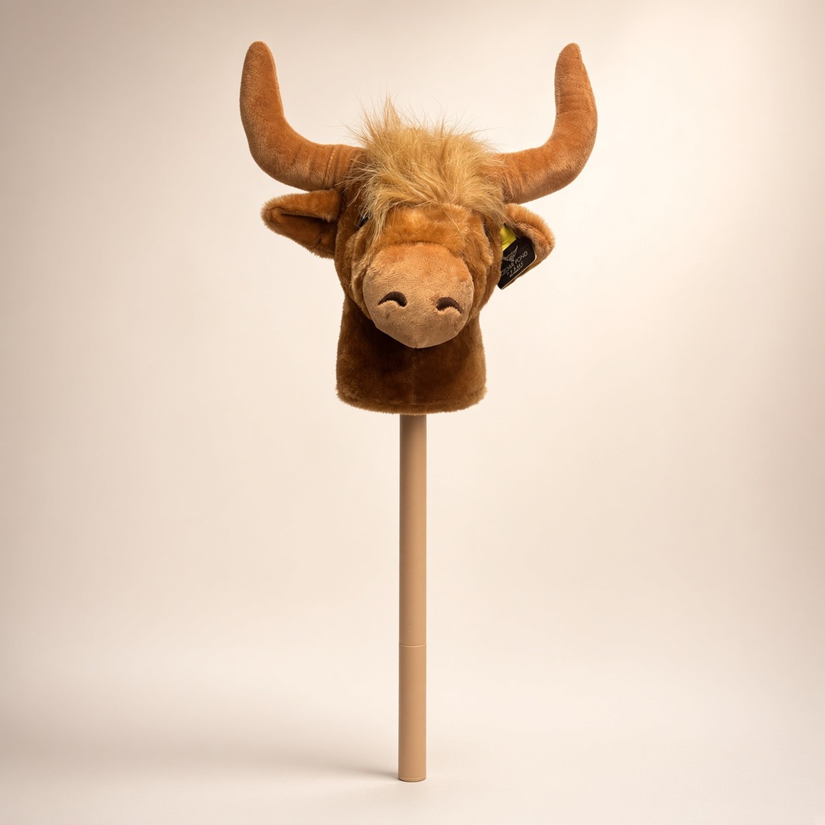 Hobby Cow on a Stick from the STUFFIES shelf at the Cedar Pond Farms gift shop — our fluffy Highland cow farm just outside the Smoky Mountains.