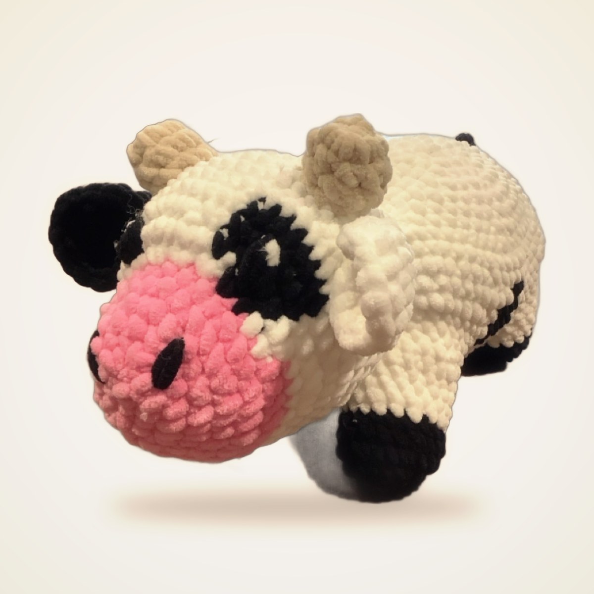 Crochet Black White Cow from the STUFFIES shelf at the Cedar Pond Farms gift shop — our fluffy Highland cow farm just outside the Smoky Mountains.