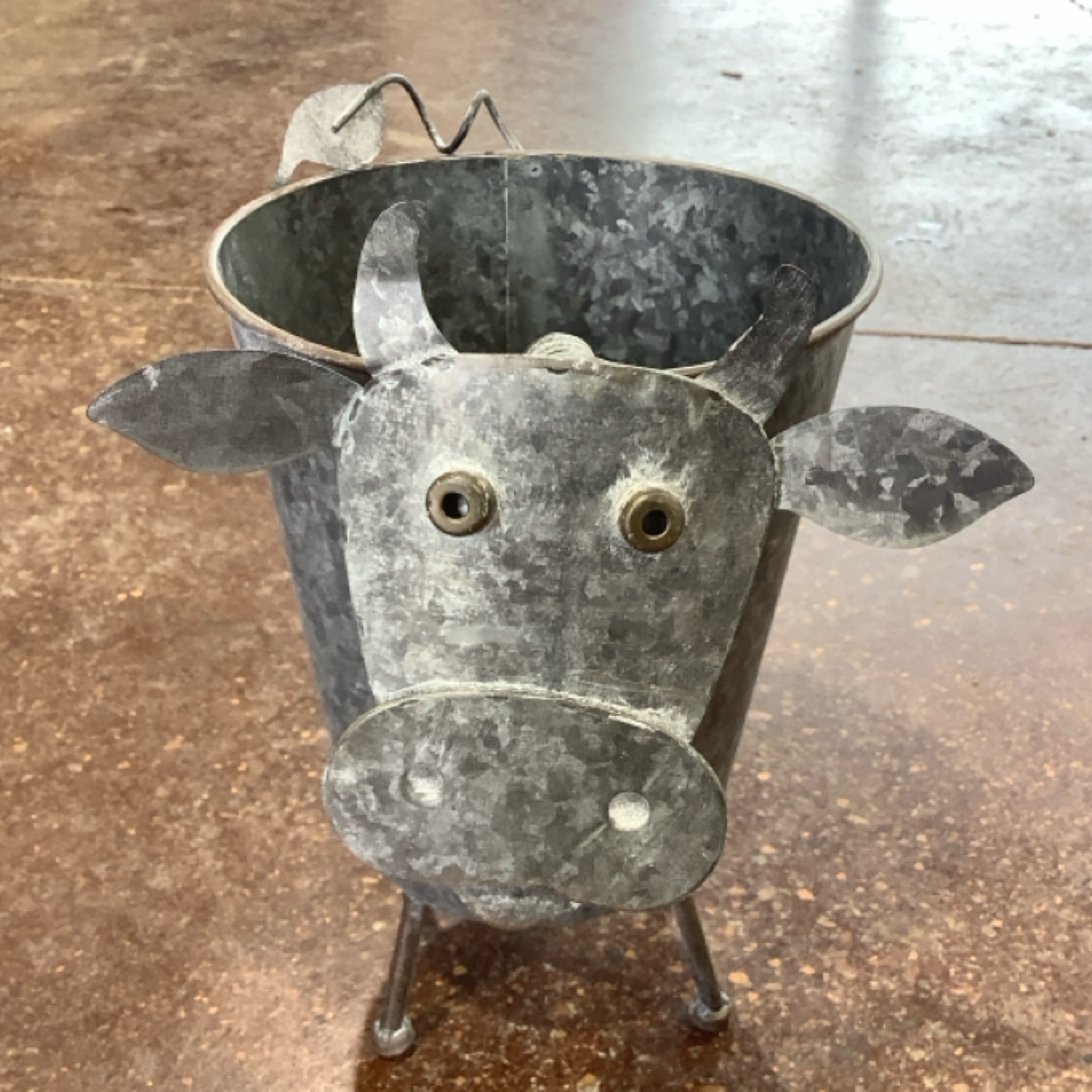 Metal Highland Cow Planter at the Cedar Pond Farms gift shop — our fluffy Highland cow farm just outside the Smoky Mountains.
