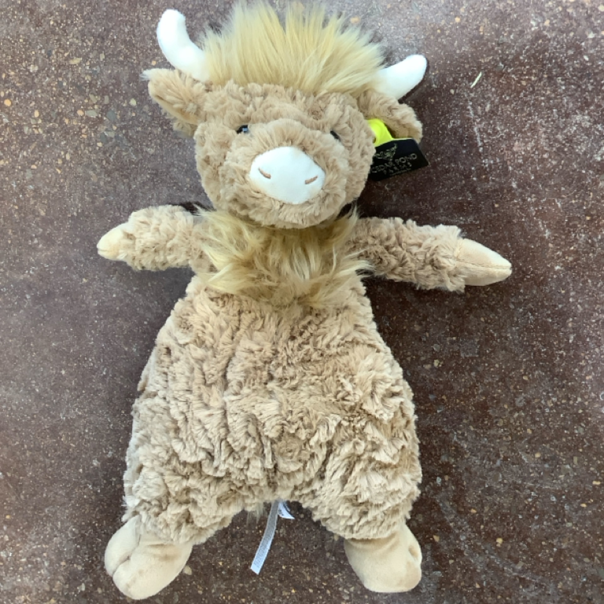 Floppy Highland Cow Stuffie at the Cedar Pond Farms gift shop — our fluffy Highland cow farm just outside the Smoky Mountains.