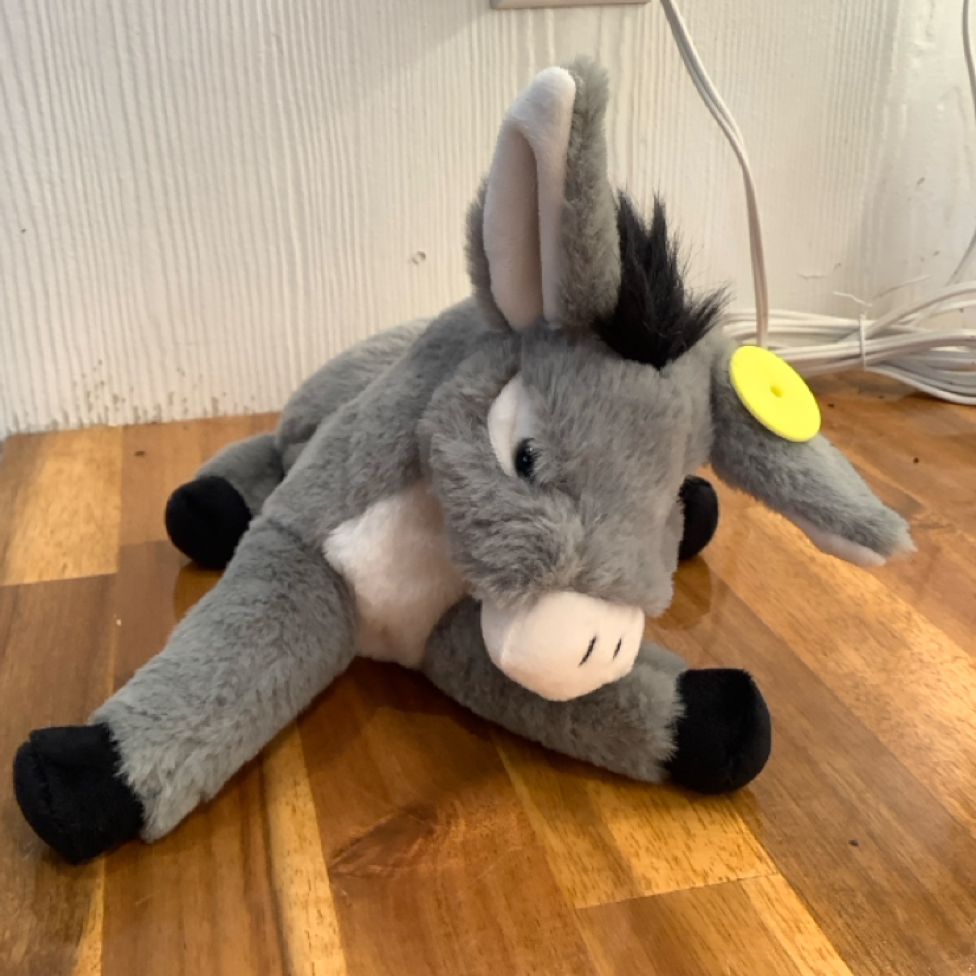 Donkey laying down from the STUFFIES shelf at the Cedar Pond Farms gift shop — our fluffy Highland cow farm just outside the Smoky Mountains.
