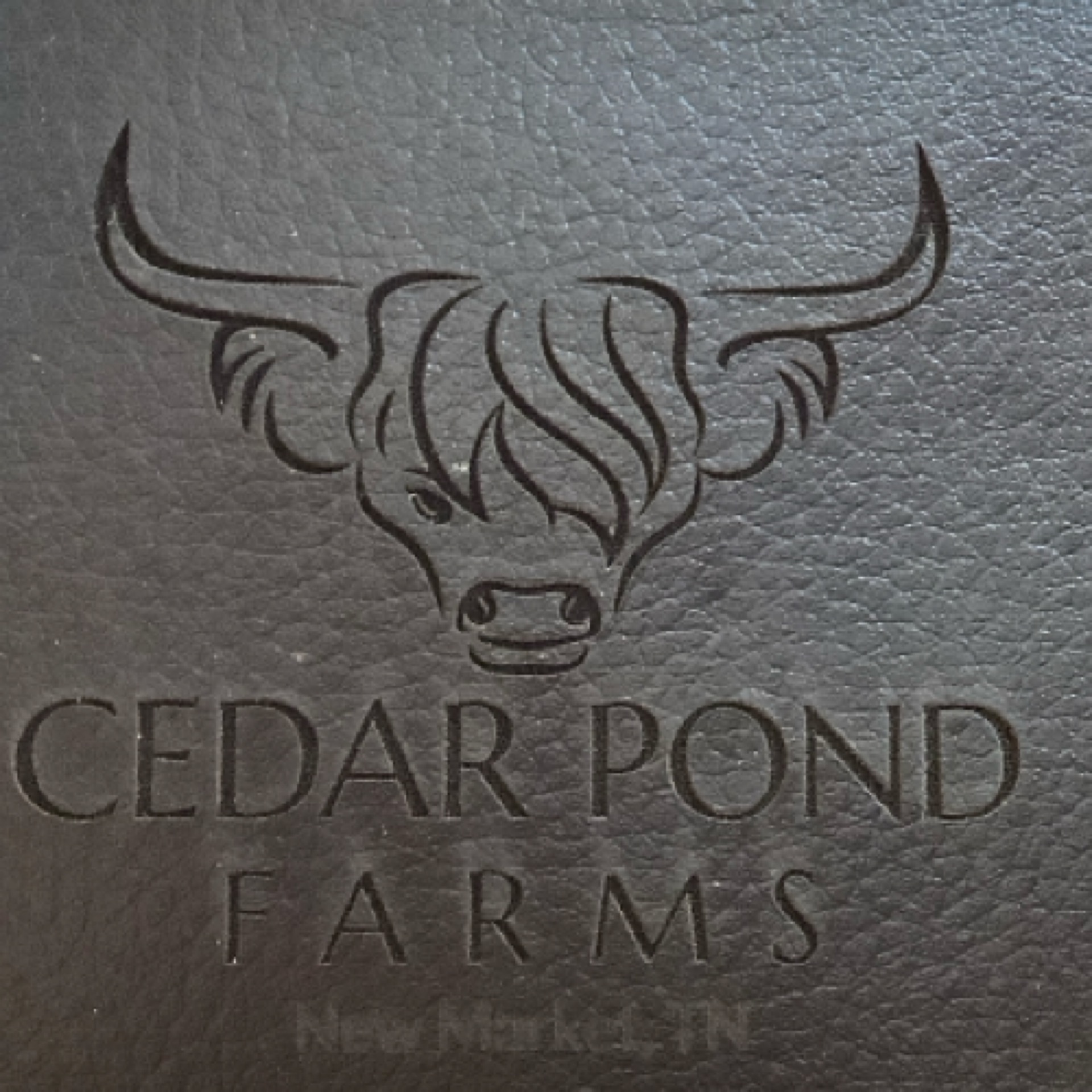 Wallet at the Cedar Pond Farms gift shop — our fluffy Highland cow farm just outside the Smoky Mountains.