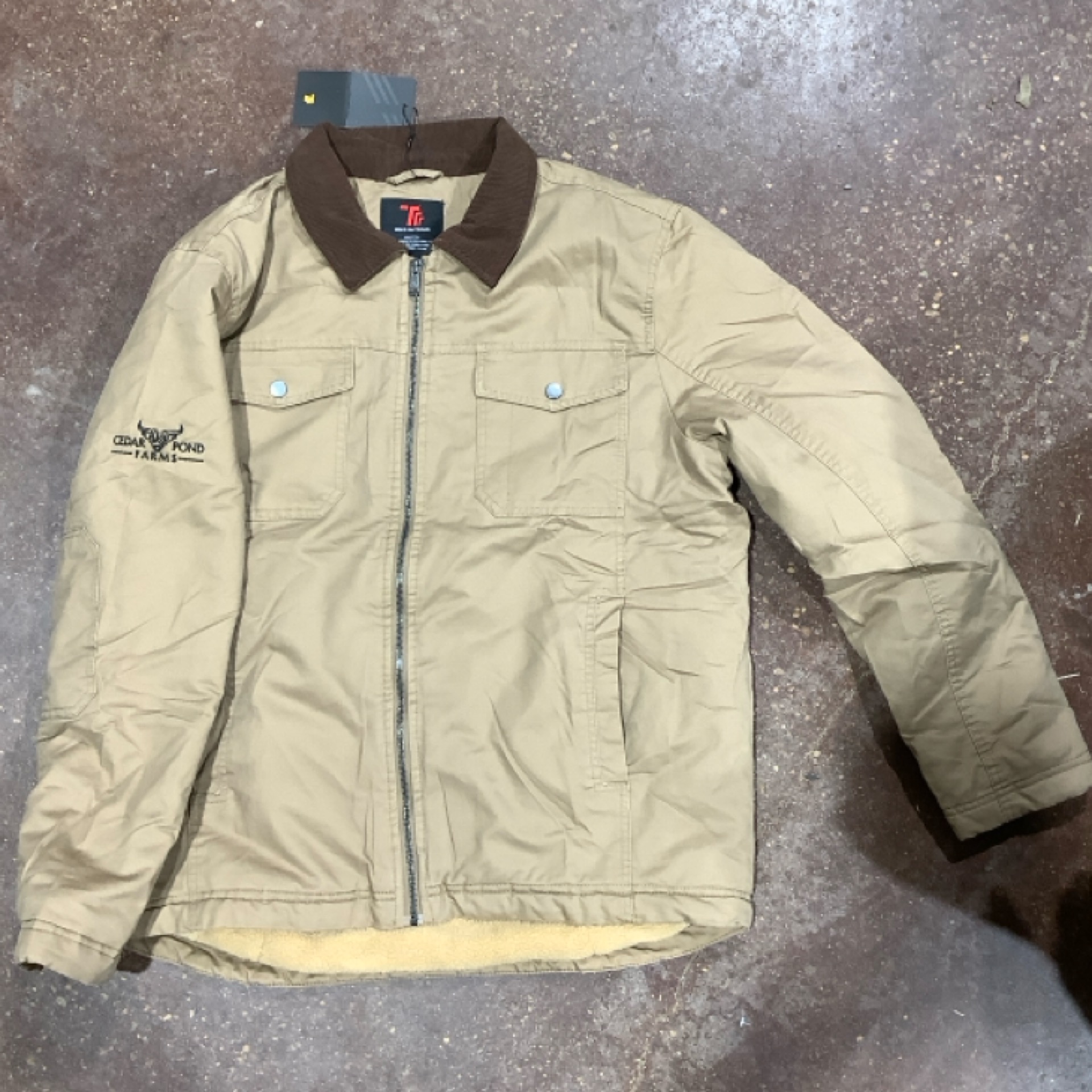 TBY Jacket at the Cedar Pond Farms gift shop — our fluffy Highland cow farm just outside the Smoky Mountains.