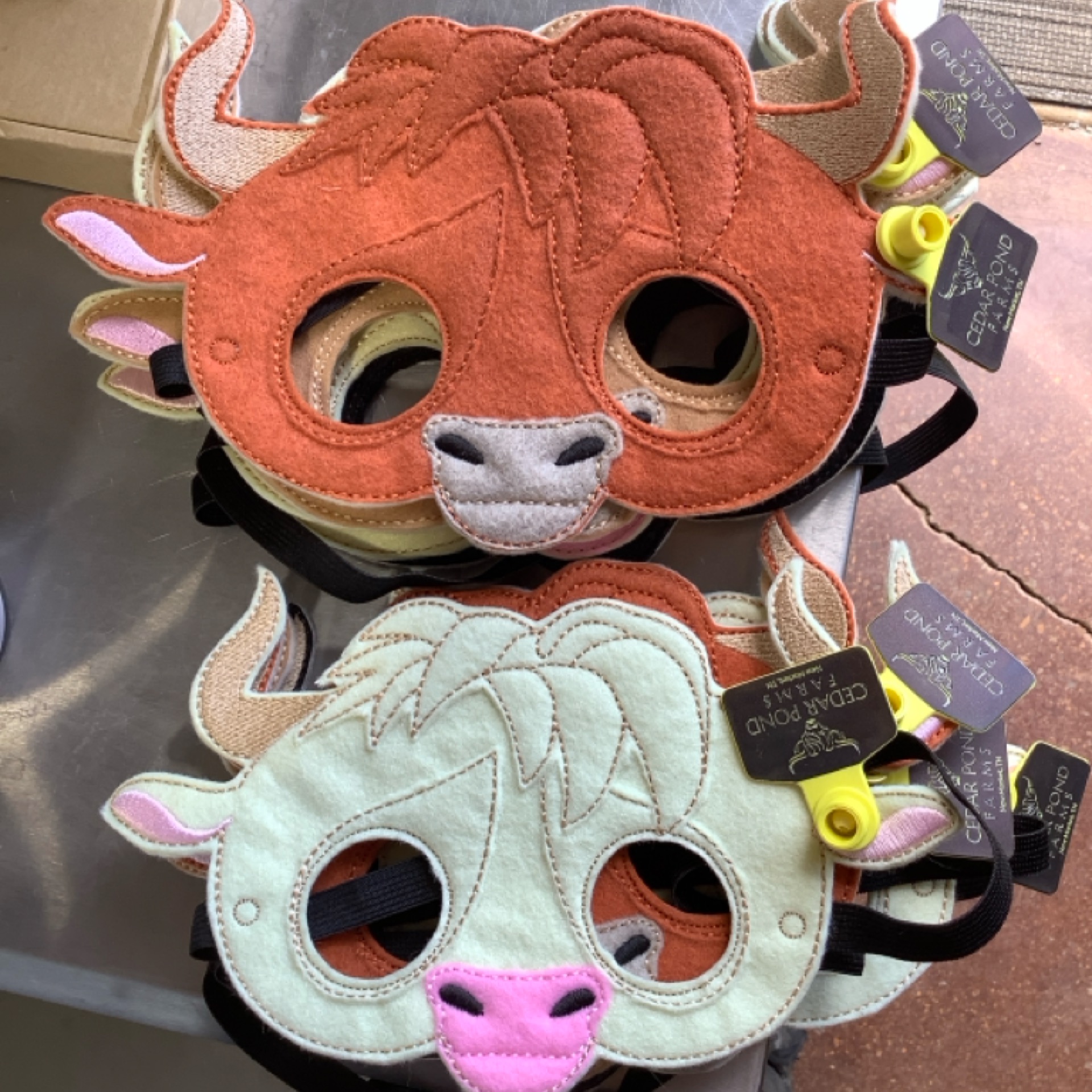 Cow Masks at the Cedar Pond Farms gift shop — our fluffy Highland cow farm just outside the Smoky Mountains.