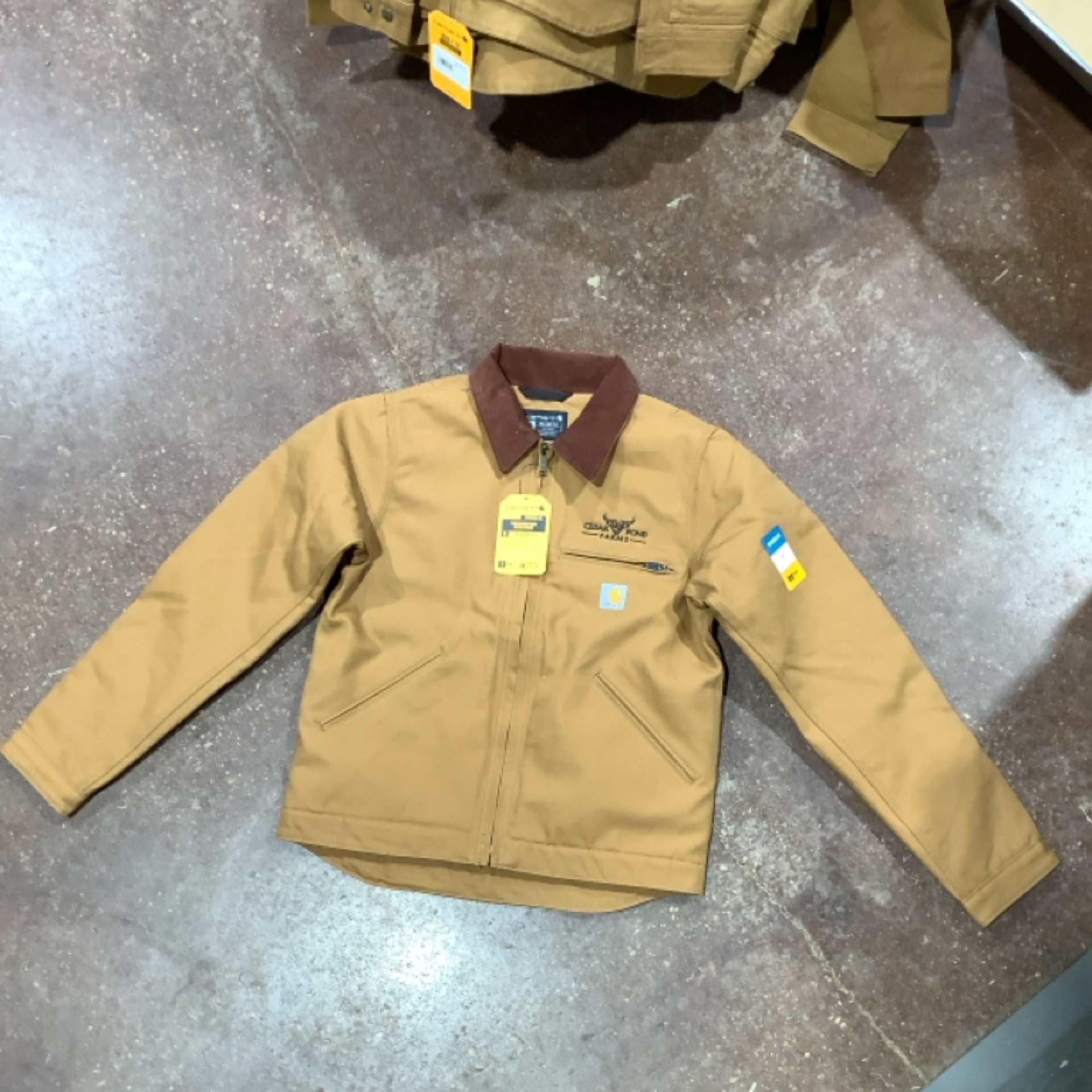 Model 0J3828-M Carhartt Corduroy Collar “Detroit” Jacket at the Cedar Pond Farms gift shop — our fluffy Highland cow farm just outside the Smoky Mountains.