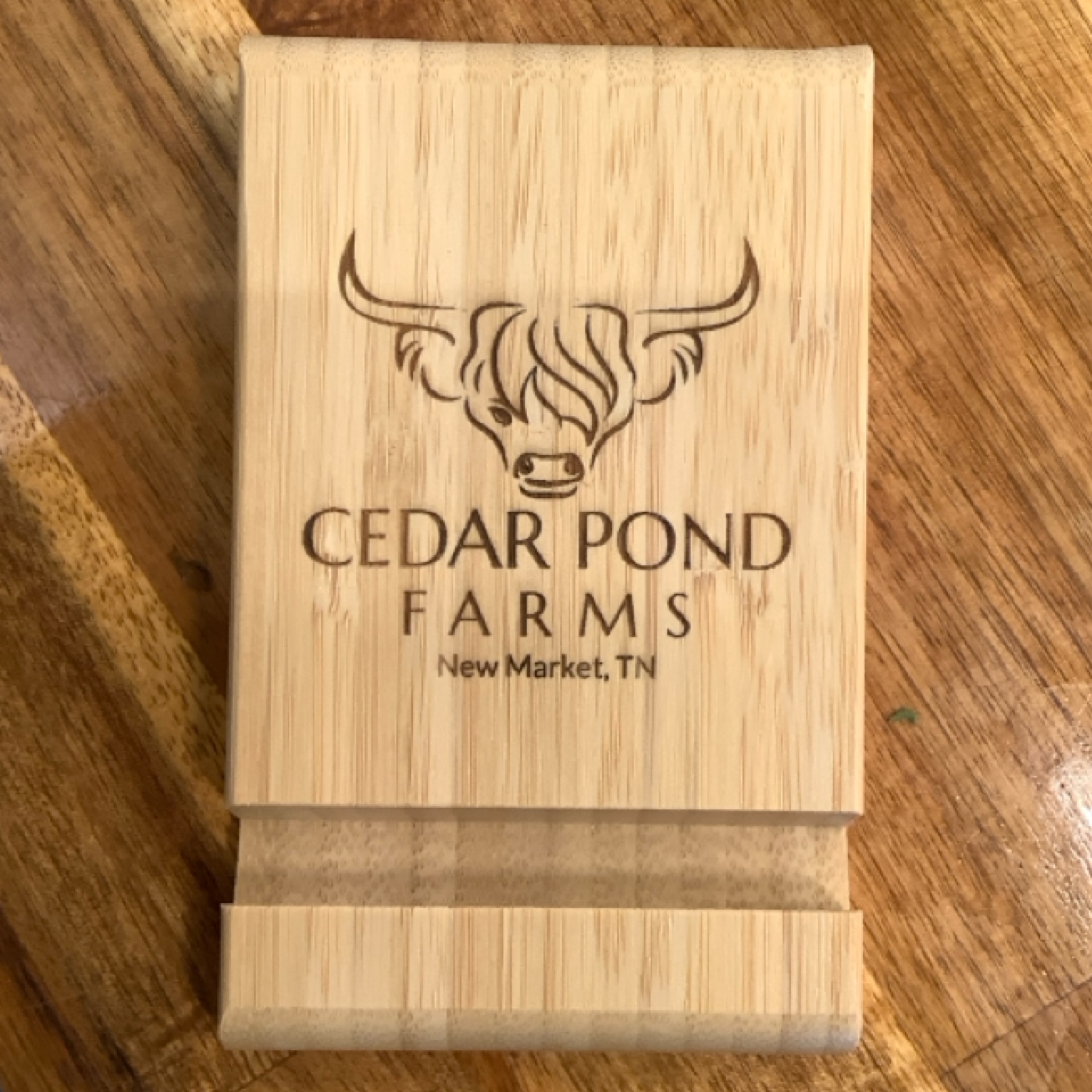 Cellphone Stand at the Cedar Pond Farms gift shop — our fluffy Highland cow farm just outside the Smoky Mountains.