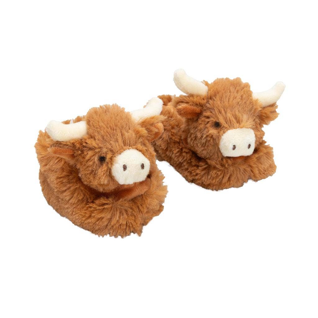 Fluffy Cow Baby Slippers at the Cedar Pond Farms gift shop — our fluffy Highland cow farm just outside the Smoky Mountains.